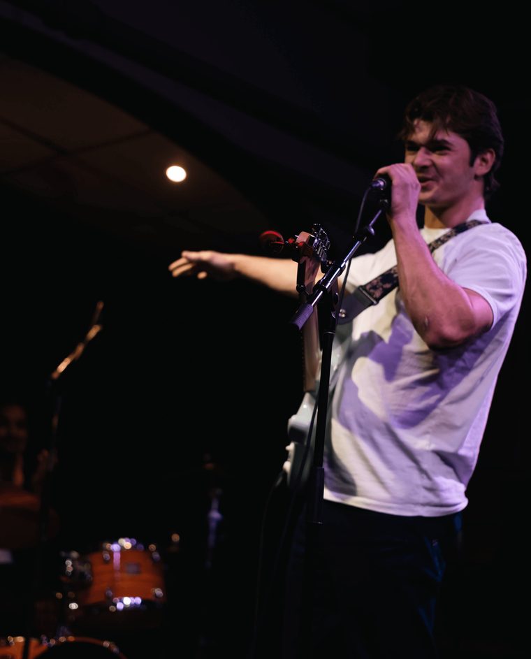 Matt on stage with a microphone